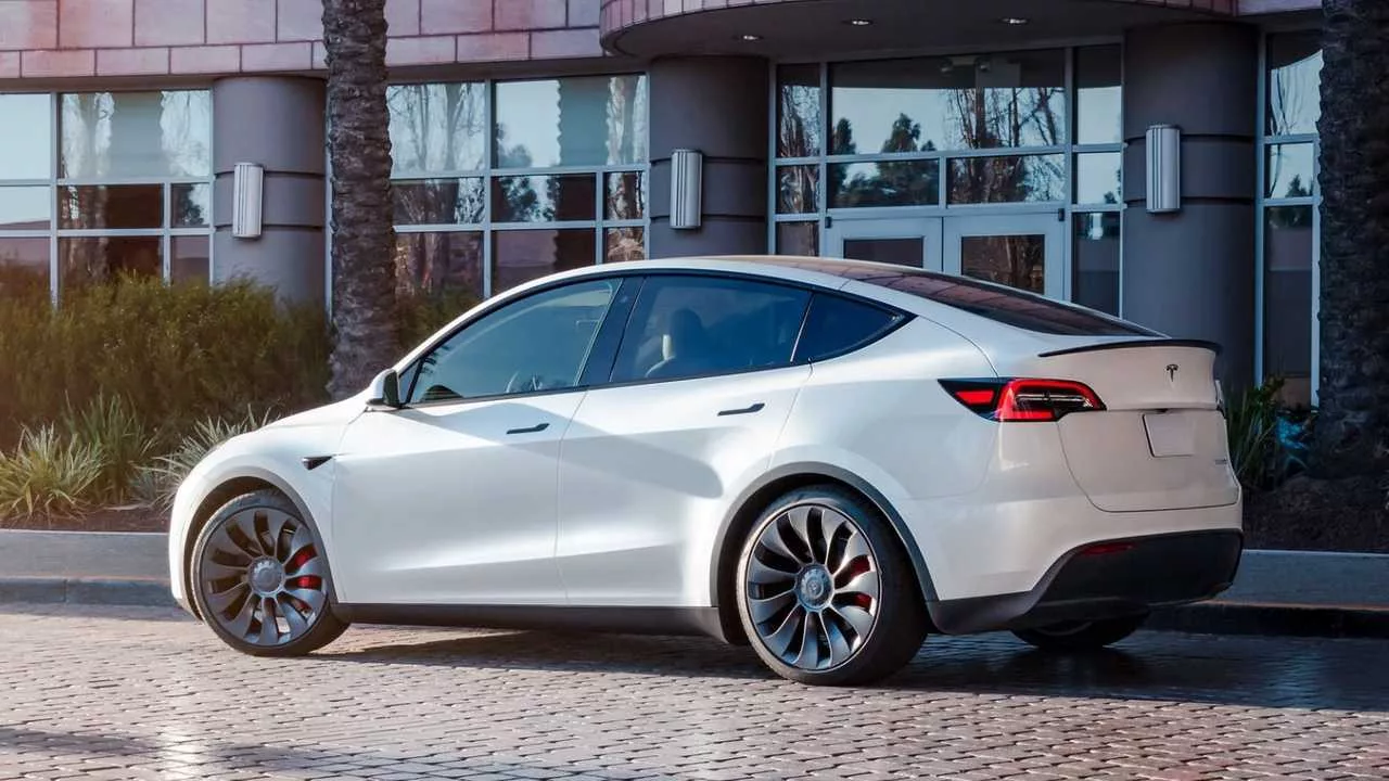 white tesla model y 21 4 2023parked
